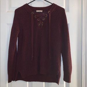 Maroon sweater. Lace down front. Gently used.